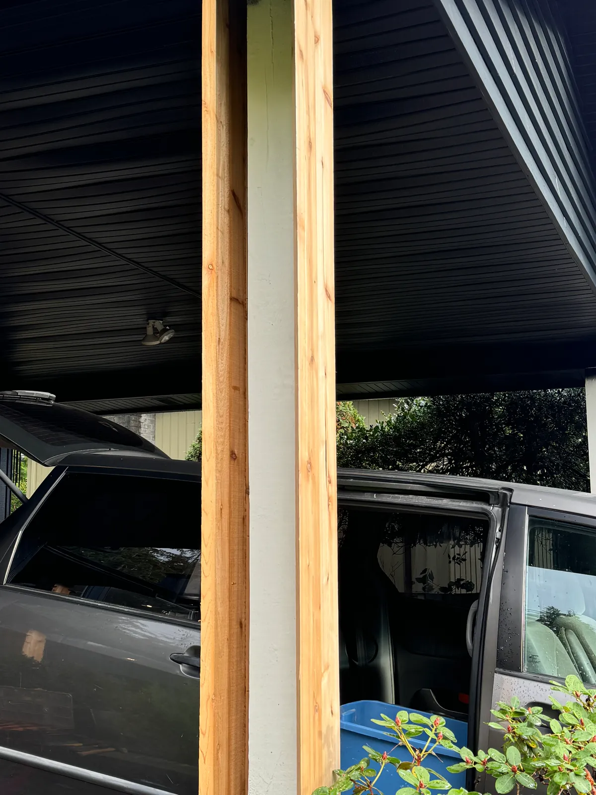 Porch column cladding, cedar boards fitted around support post