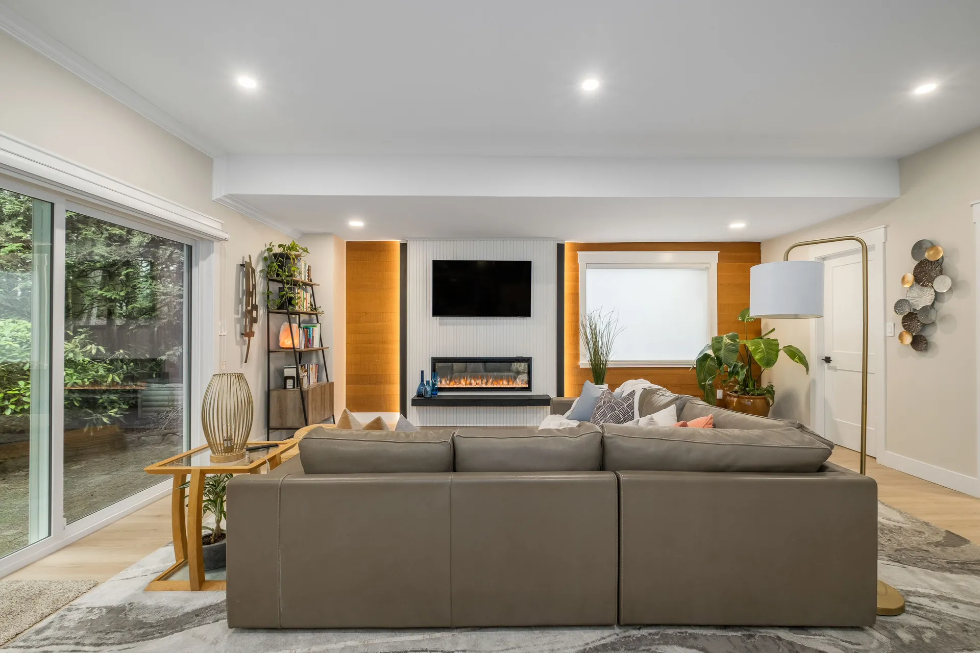 Electric fireplace accent wall in living room after renovation