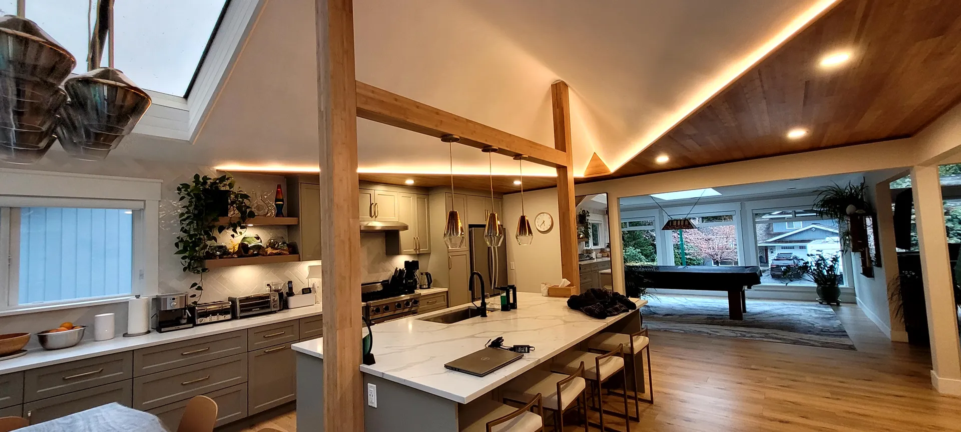 Kitchen island with pendant lights after renovation